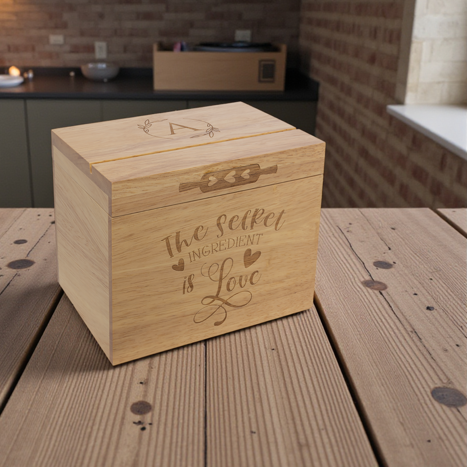 Wooden box with engraved design on a rustic wooden table