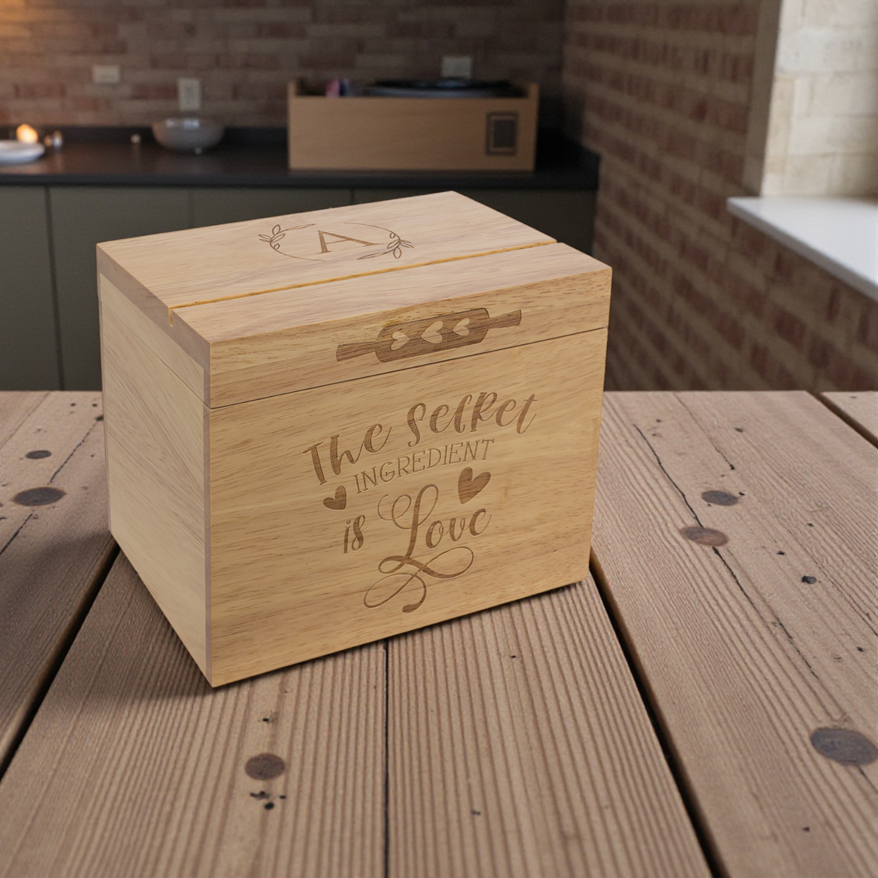 Wooden box with engraved design on a rustic wooden table