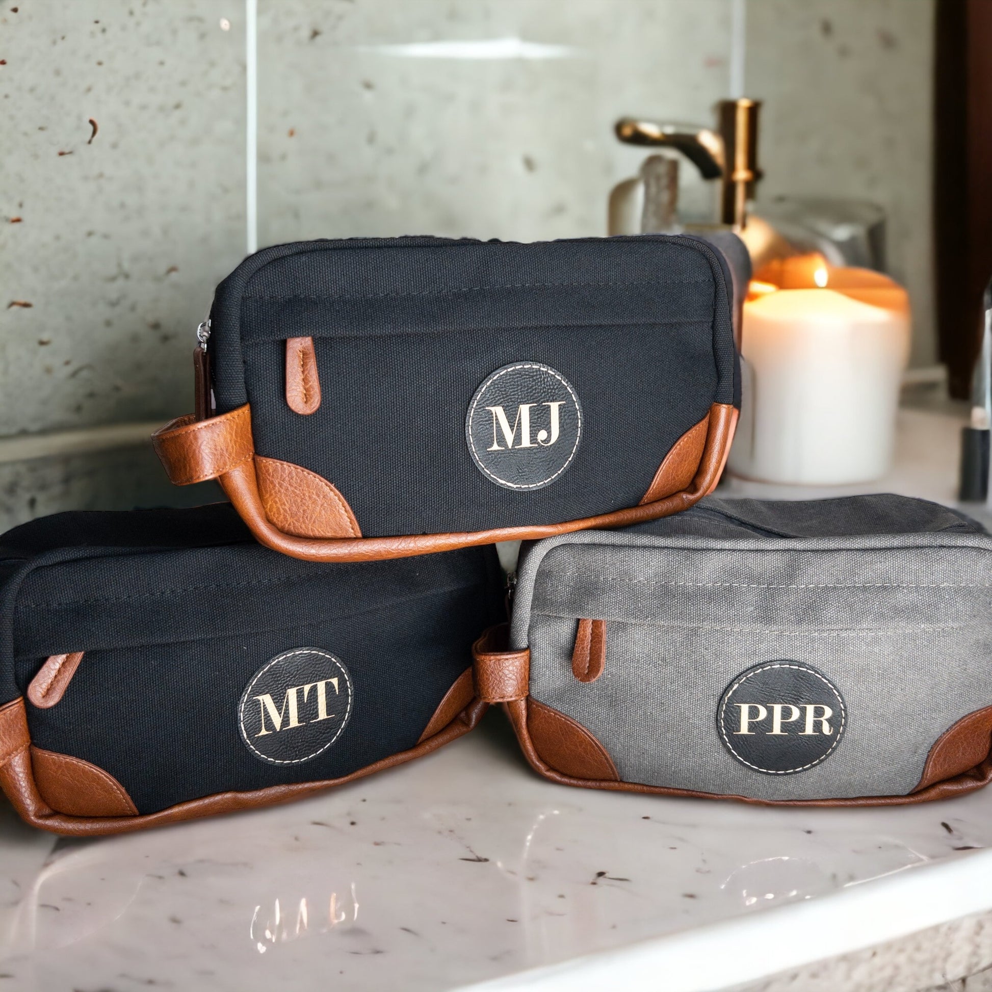 Stylish travel toiletry bag, suspended to display its features. A standout customizable leather patch accents its elegant design.