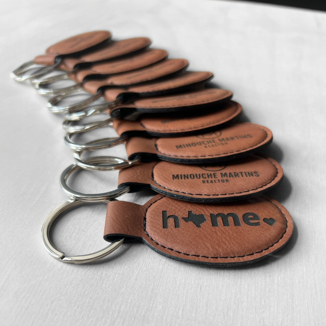 Custom laserable leatherette keychains designed by HP Design in McKinney, Texas. Perfect for realtors, promotional gifts, or personalized branding.

This description highlights the customization and relevance of your business while remaining concise and keyword-optimized. Let me know if you need adjustments!