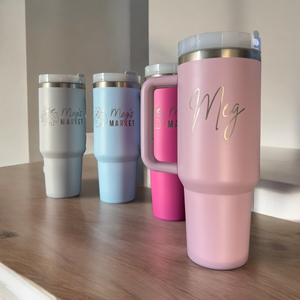 Custom engraved powder-coated tumbler brought in by customer, laser etched with name and design by HP Design in McKinney, Texas – personalized tumbler engraving service for gifts, branding, and realtors.
